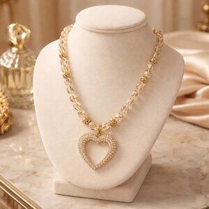 Rhinestone heart pendant strung on clear crystal beads